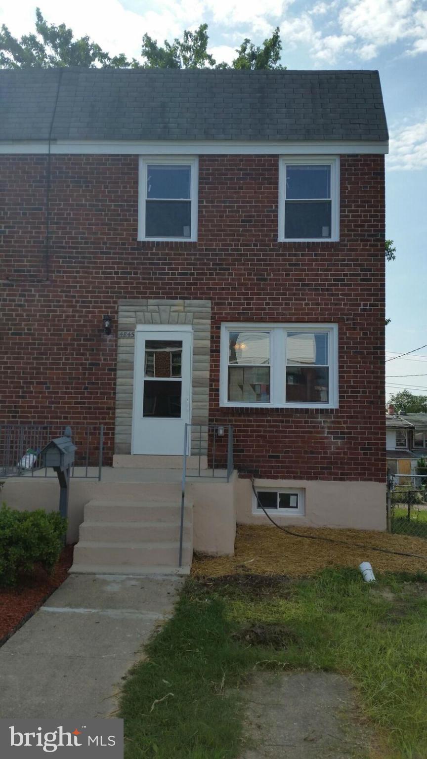 4845 Greencrest Road Baltimore, MD 21206 - Photo 27 of 28 a brick house with a yard in front of it