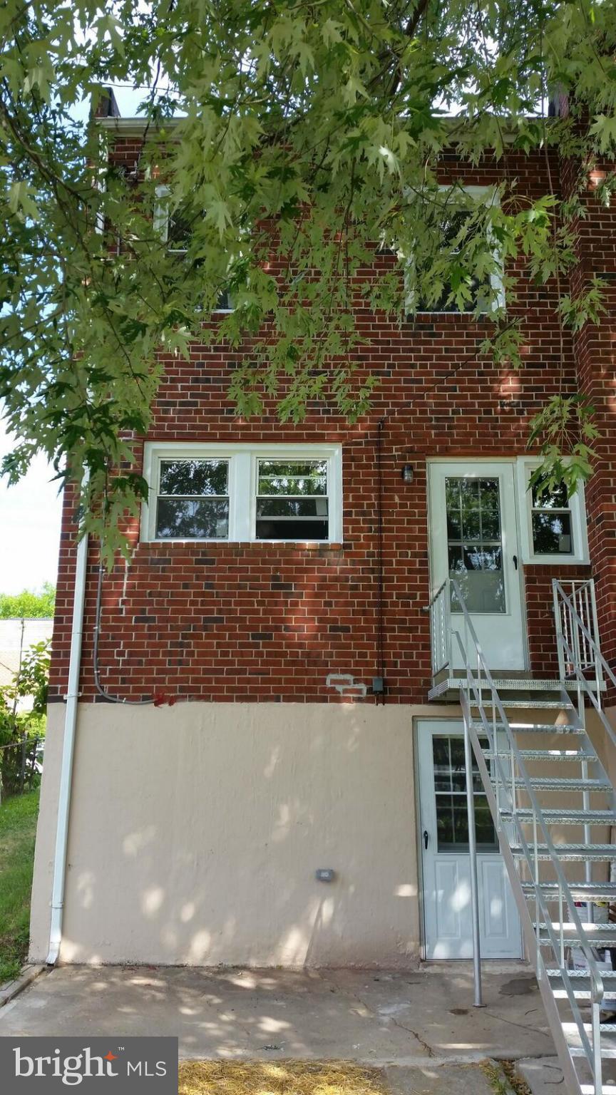 4845 Greencrest Road Baltimore, MD 21206 - Photo 4 of 28 a view of a building with a tree