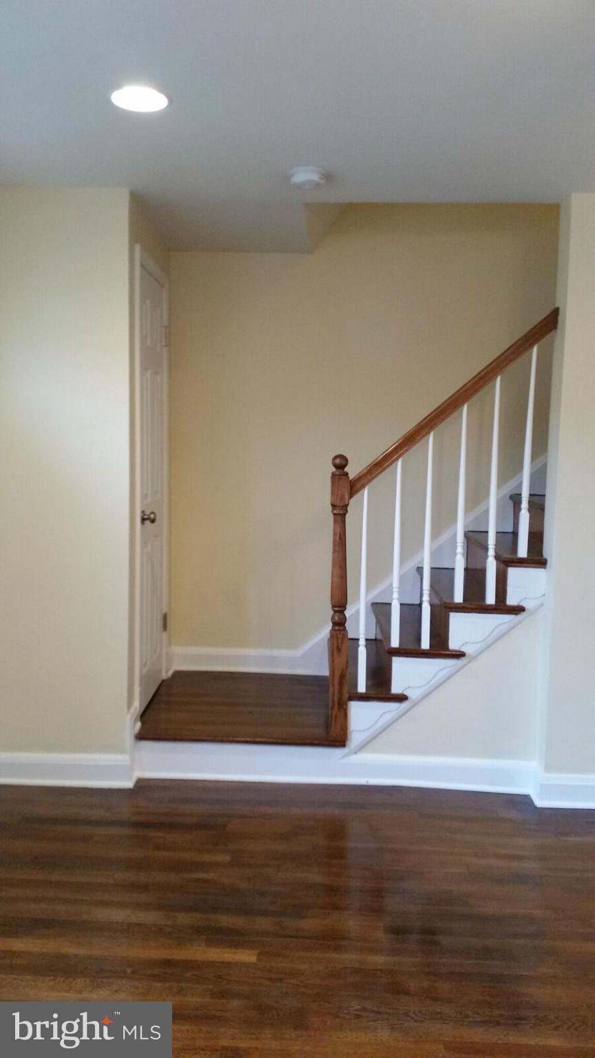 4845 Greencrest Road Baltimore, MD 21206 - Photo 6 of 28 a view of wooden floor and windows in a room