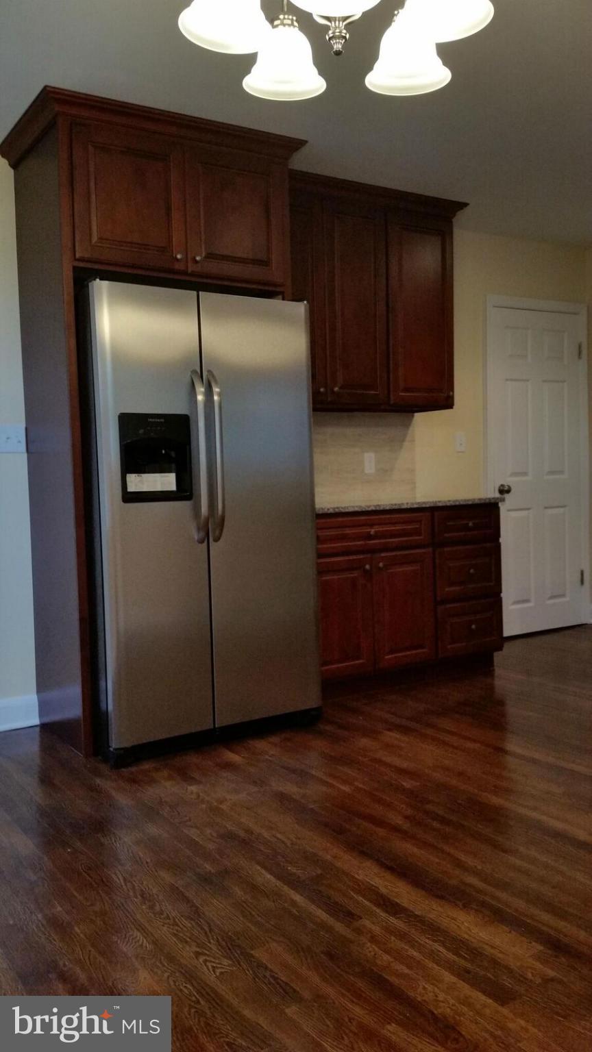 4845 Greencrest Road Baltimore, MD 21206 - Photo 8 of 28 a view of a kitchen with wooden floor