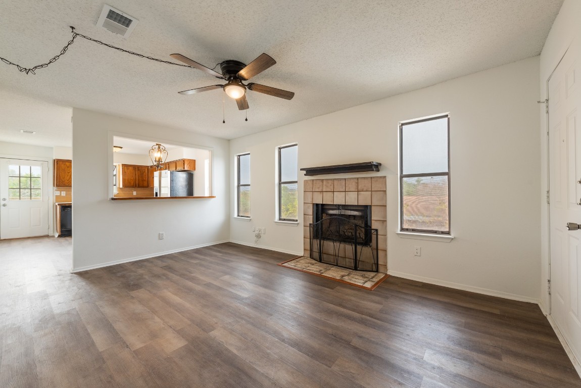 6910 Rifle Bend, Unit B Austin, TX 78736 - Photo 3 of 17 Open Living Room with wood burning fireplace