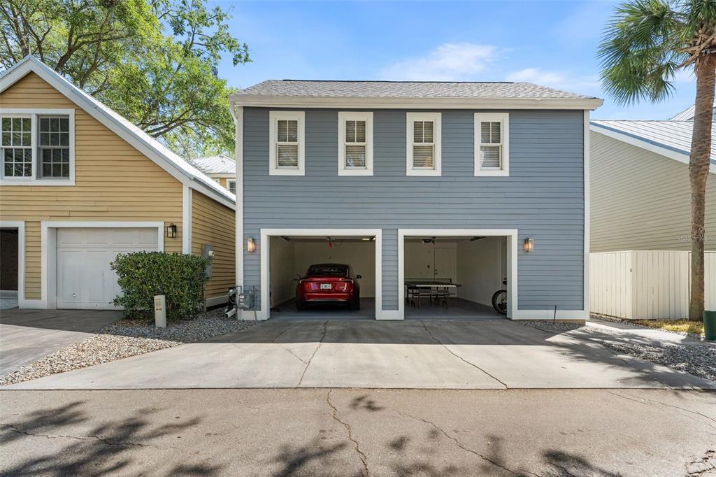 4964 Southwest 91st Drive Gainesville, FL 32608 - Photo 59 of 64 a front view of a house with a yard and garage
