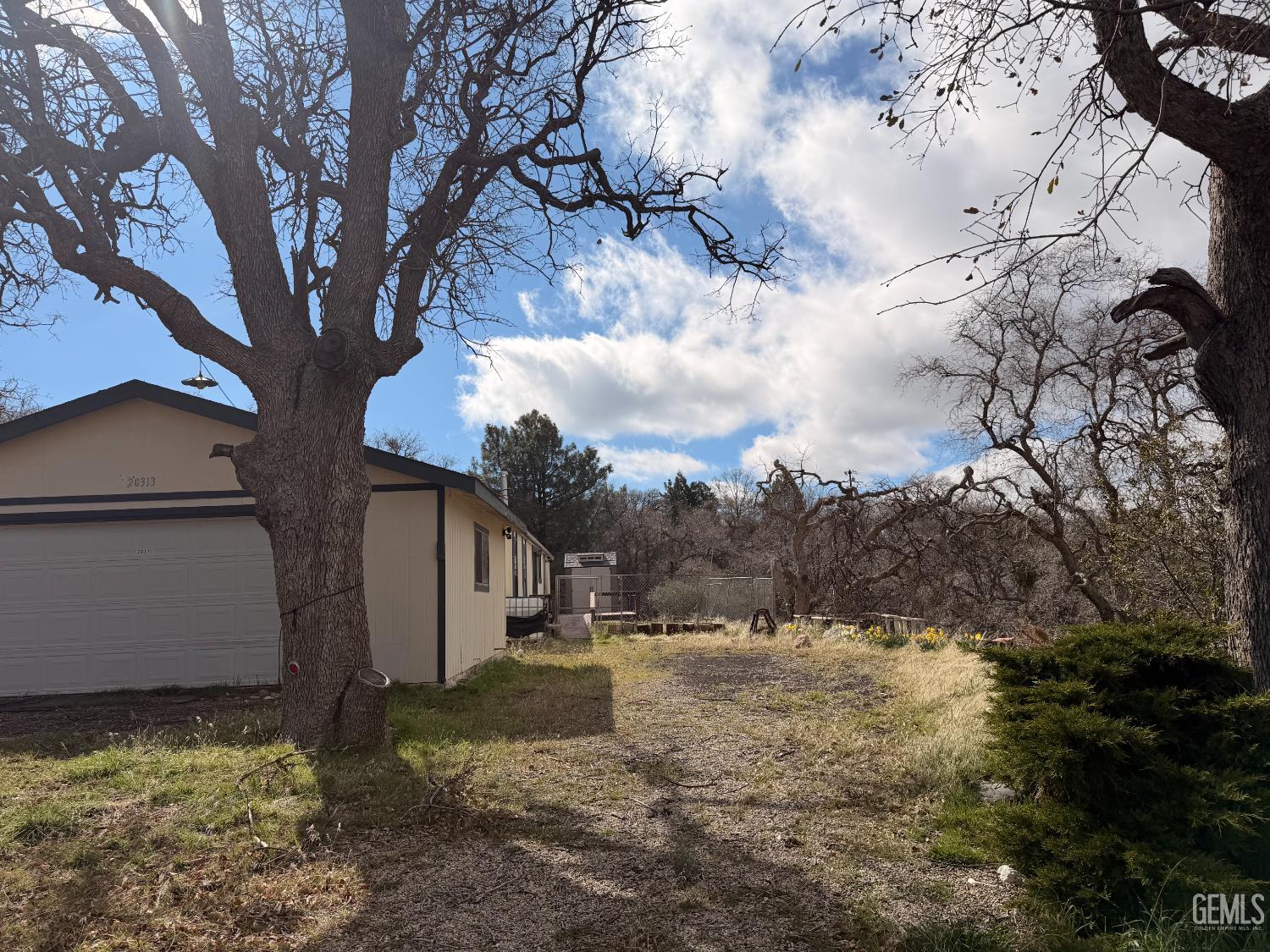 Undisclosed Address Tehachapi, CA 93561 - Photo 2 of 15 a view of a yard with large tree