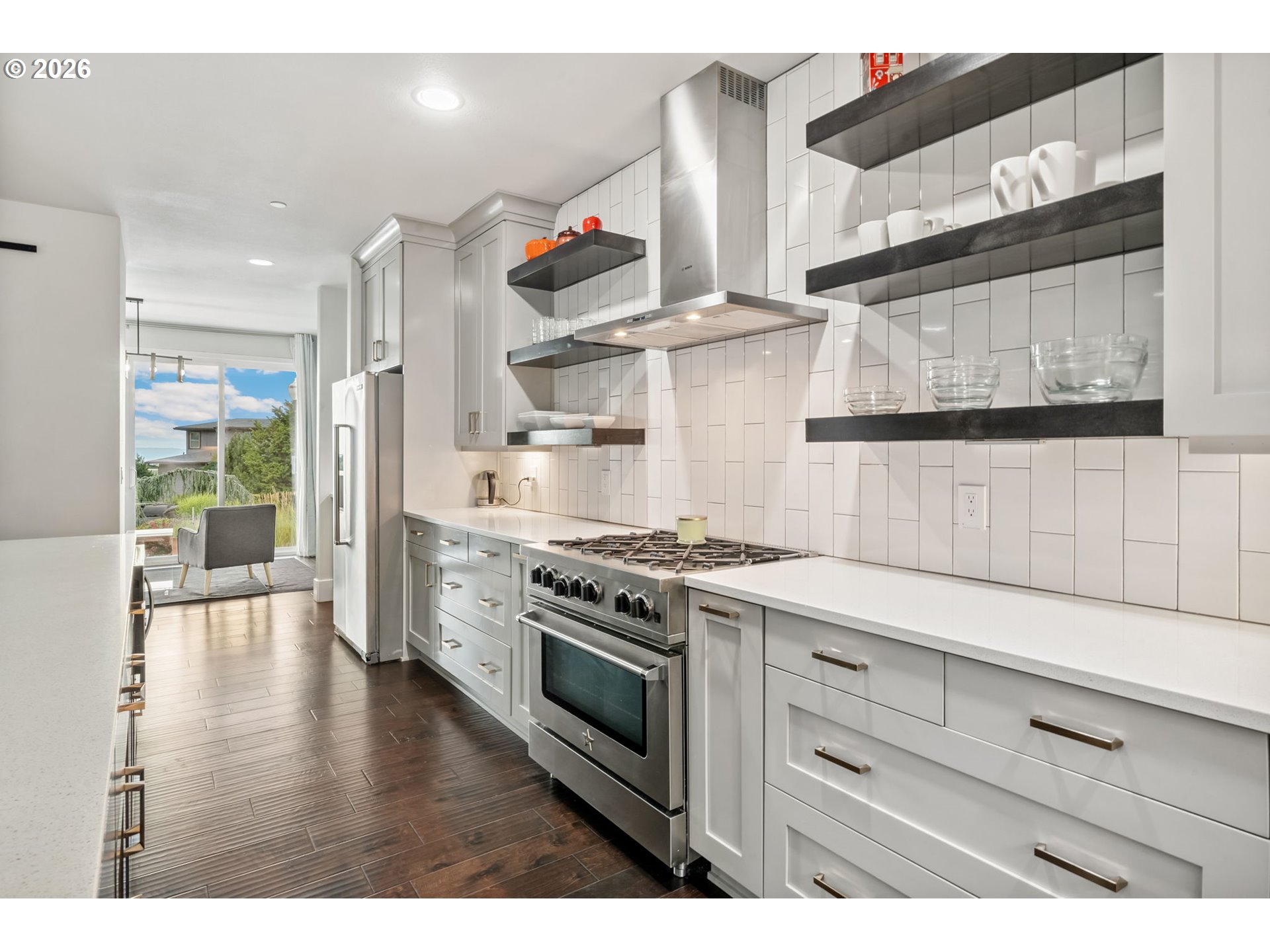 1730 Northwest Klickitat Street Camas, WA 98607 - Photo 16 of 48 a kitchen with stainless steel appliances a stove and white cabinets