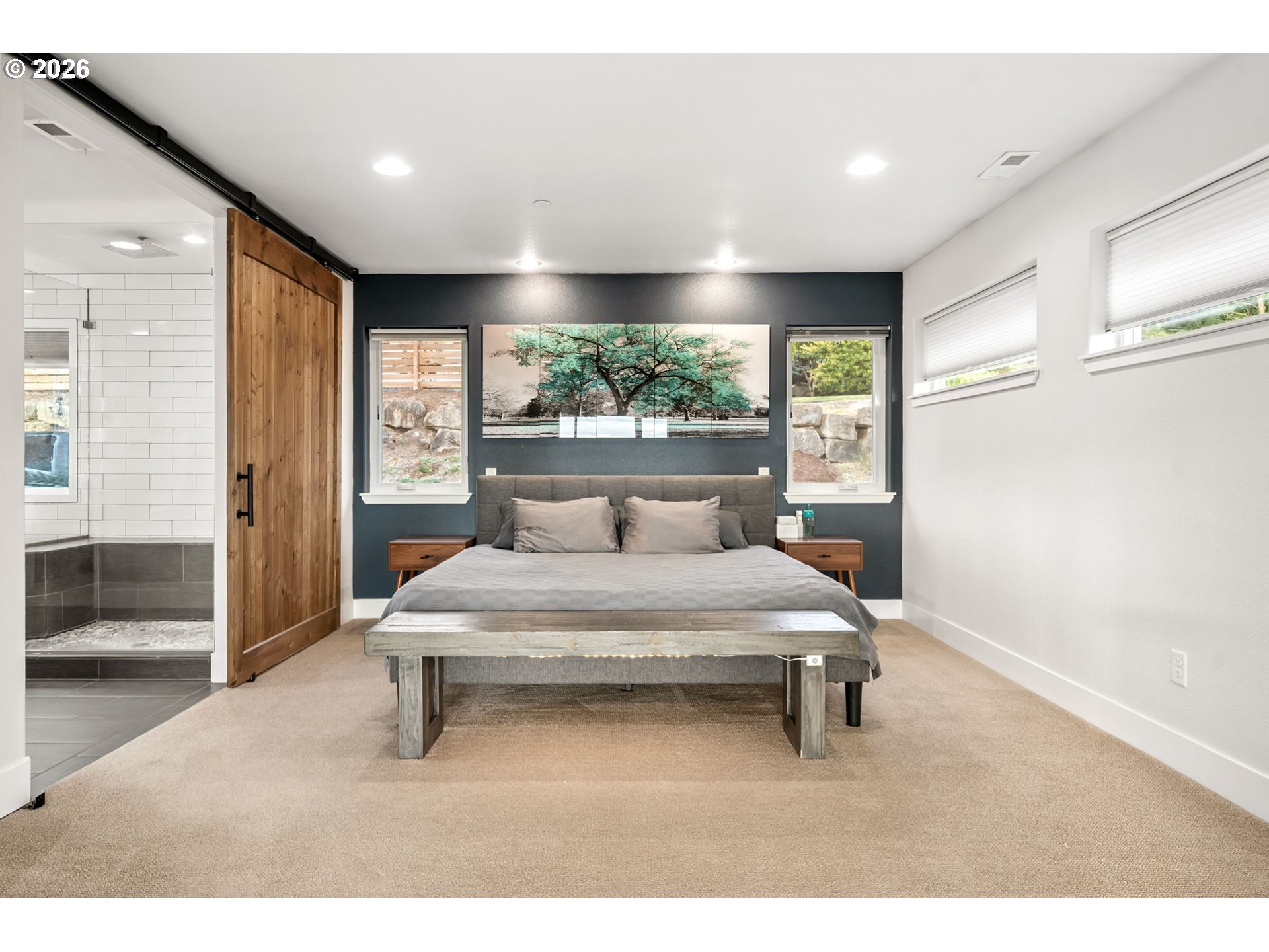 1730 Northwest Klickitat Street Camas, WA 98607 - Photo 28 of 48 a spacious bedroom with a bed and a large window