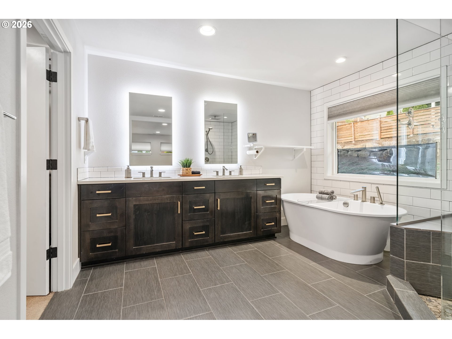 1730 Northwest Klickitat Street Camas, WA 98607 - Photo 30 of 48 a bathroom with a tub sink double vanity and mirror