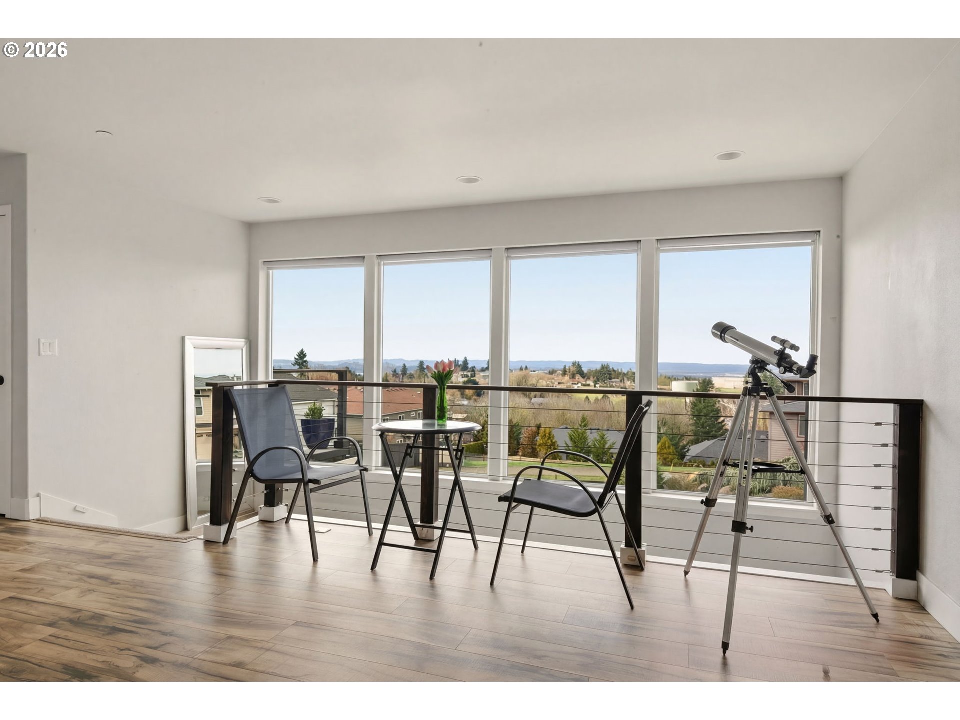 1730 Northwest Klickitat Street Camas, WA 98607 - Photo 34 of 48 a dining room with furniture and a floor to ceiling window
