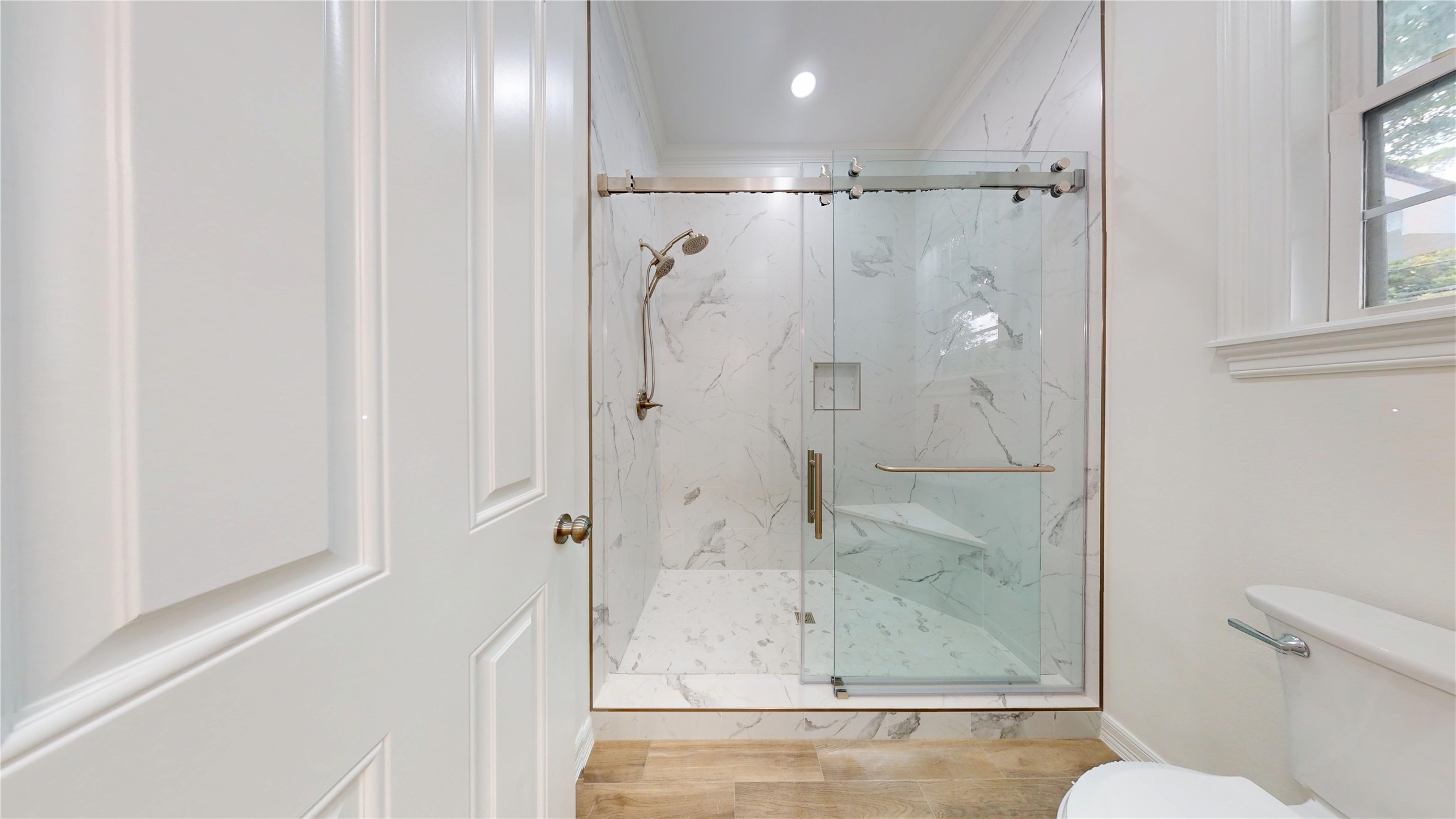 4050 Dumbarton Street Houston, TX 77025 - Photo 31 of 48 Remodeled Primary Walk-in Shower with tile flooring.