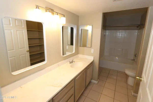 a bathroom with a tub and a sink