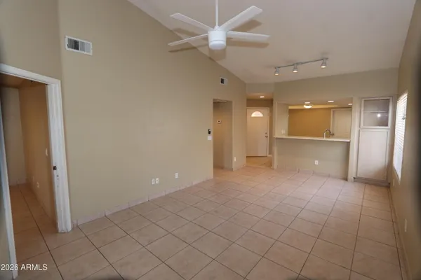 a view of a hallway with a bathroom