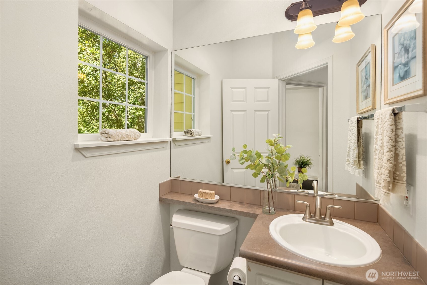 1800 Northeast 40th Street, Unit C1 Renton, WA 98056 - Photo 12 of 23 a bathroom with a sink and a mirror