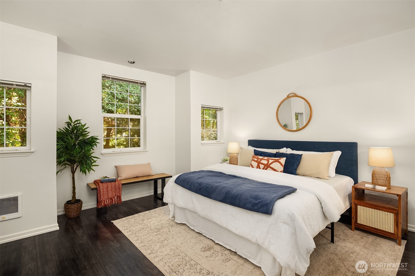 1800 Northeast 40th Street, Unit C1 Renton, WA 98056 - Photo 13 of 23 a bedroom with a large bed and a potted plant