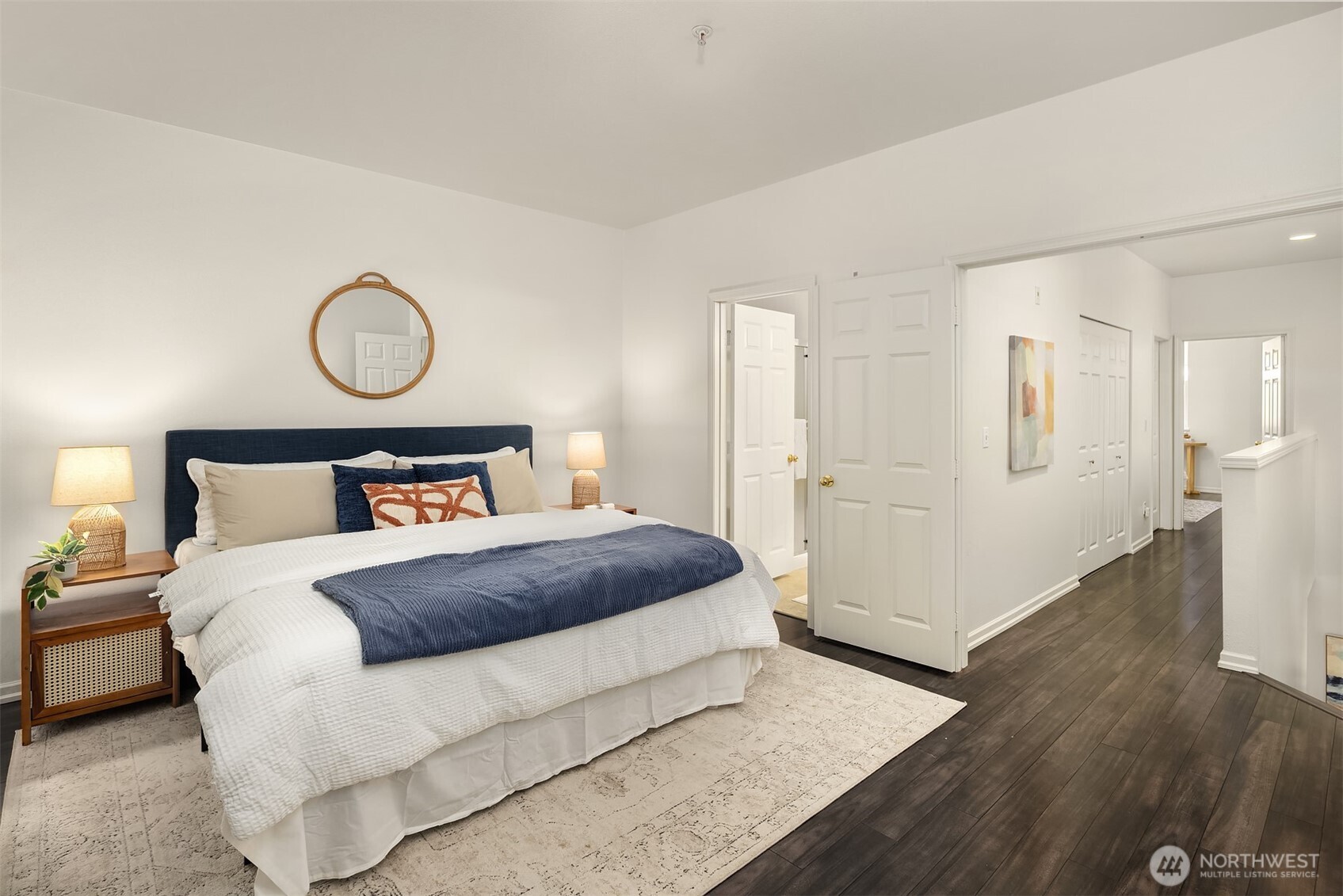 1800 Northeast 40th Street, Unit C1 Renton, WA 98056 - Photo 14 of 23 a bedroom with a bed and wooden floor