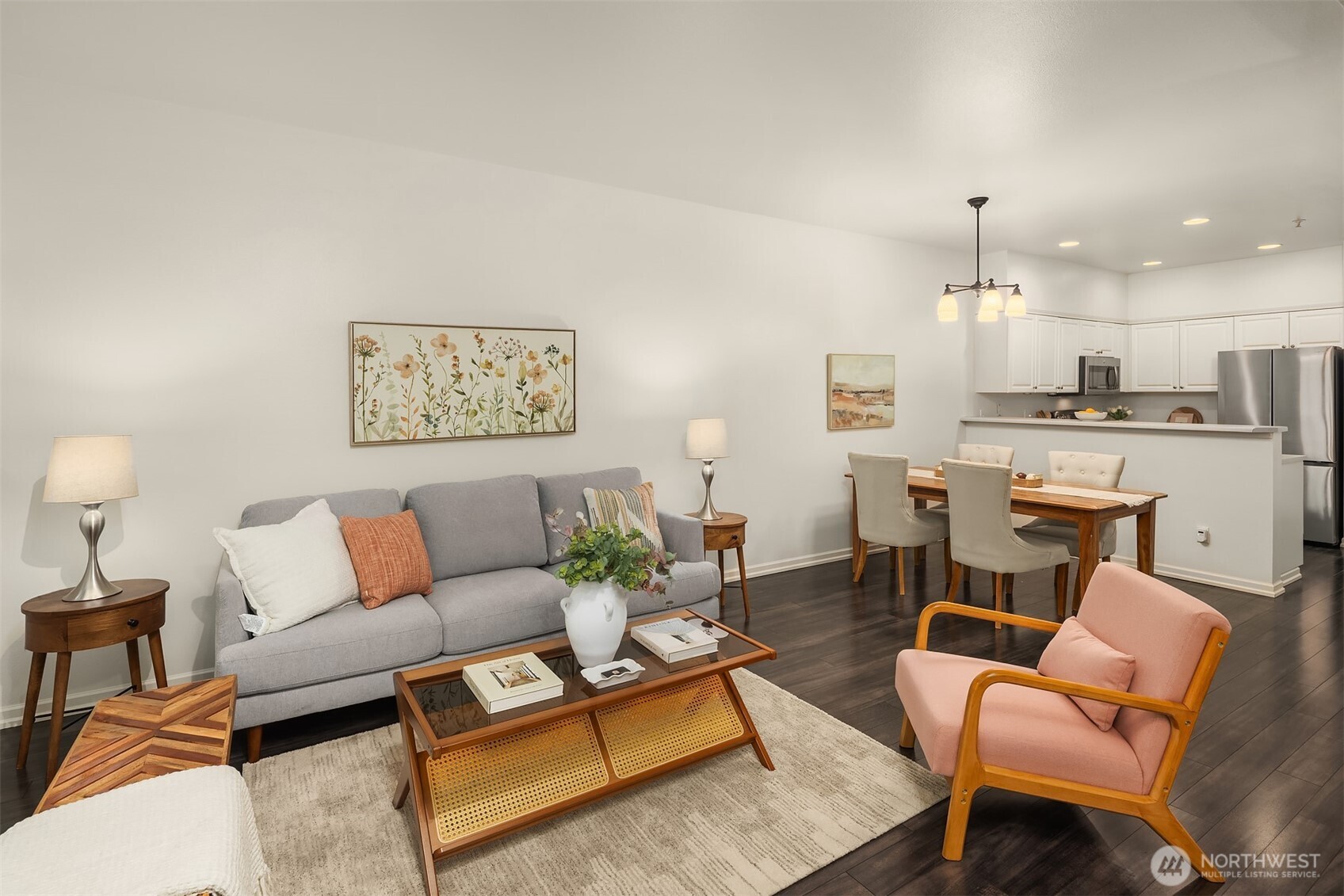1800 Northeast 40th Street, Unit C1 Renton, WA 98056 - Photo 3 of 23 a living room with furniture kitchen view and a chandelier