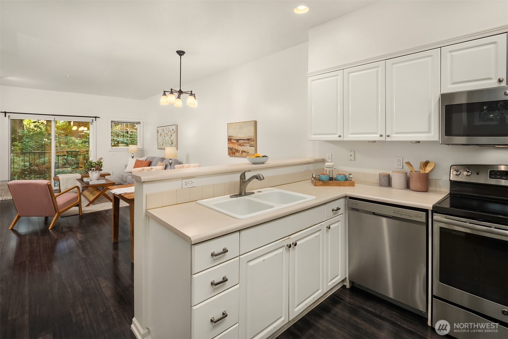 1800 Northeast 40th Street, Unit C1 Renton, WA 98056 - Photo 9 of 23 a kitchen with a sink stove and cabinets