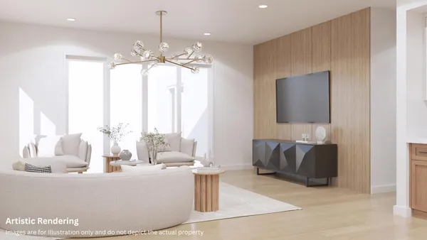 a living room with furniture and a chandelier