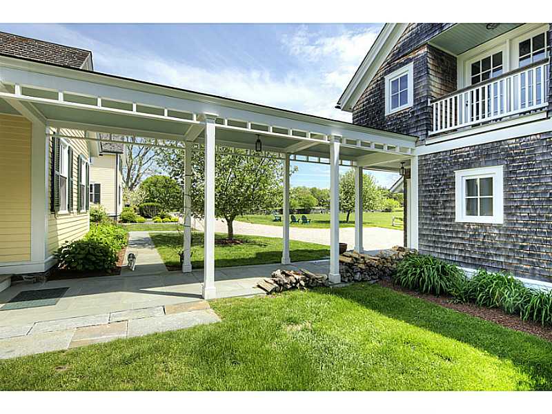 563 Puncatest Neck Road Tiverton, RI 02878 - Photo 22 of 25 Parking Lot/Garage. breeze way that attached from main house to 3-car garage (bottom) with guest cottage/quarters (above) - 2 bed 2bath with kitchen