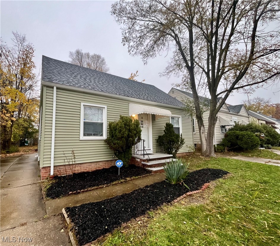 20907 Watson Road Maple Heights, OH 44137 - Photo 2 of 20 Bungalow with roof with shingles and a front lawn