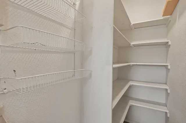 a view of an empty walk in closet