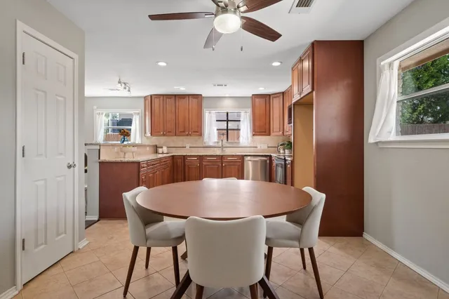 a view of a dining room with furniture and window