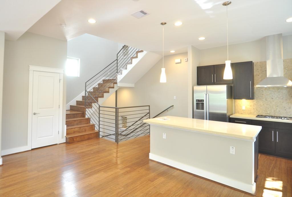 4303 Dickson Street, Unit A Houston, TX 77007 - Photo 11 of 30 a view of a kitchen with cabinets and wooden floor