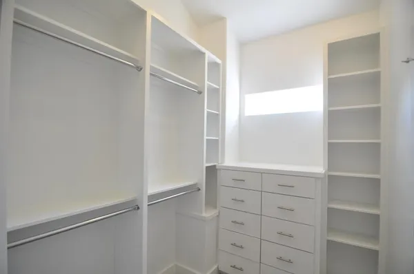 a view of an empty walk in closet