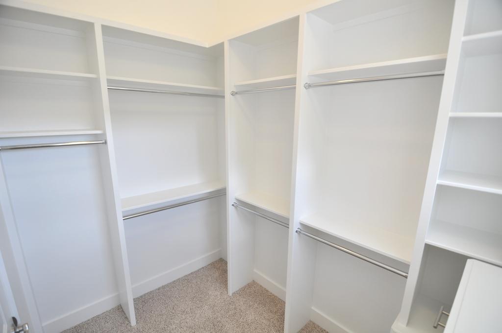 4303 Dickson Street, Unit A Houston, TX 77007 - Photo 8 of 30 a walk in closet with white cabinets