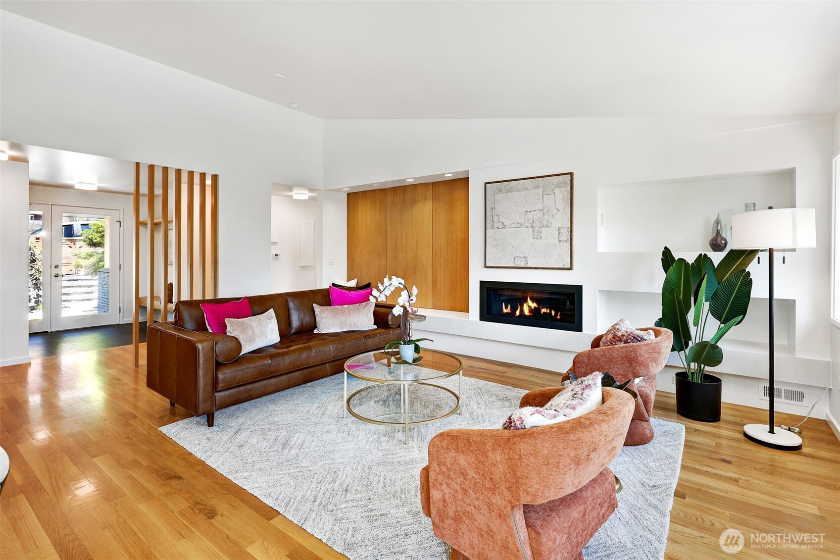 2547 Northeast 83rd Street Seattle, WA 98115 - Photo 5 of 38 a living room with furniture fireplace and a potted plant