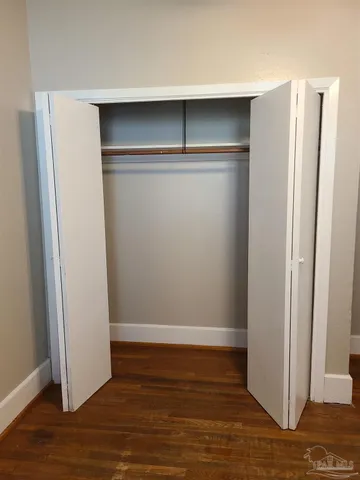 a view of room with wooden floor