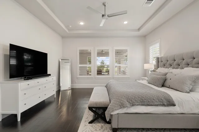 a bedroom with a bed couch and a window