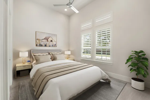 a bed room with a bed and a window