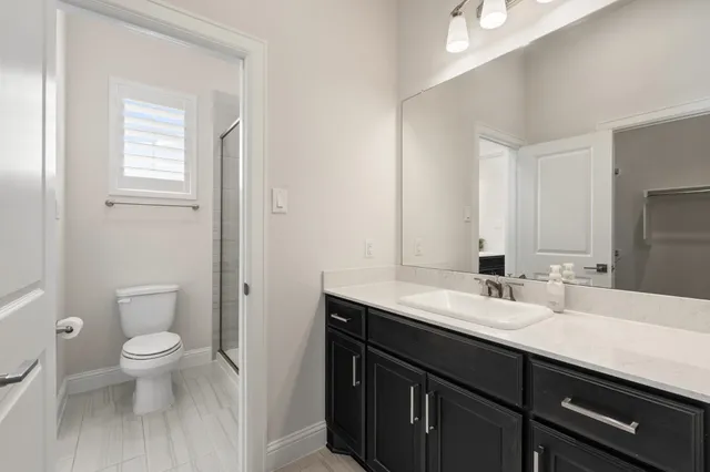 a bathroom with a sink double vanity and shower