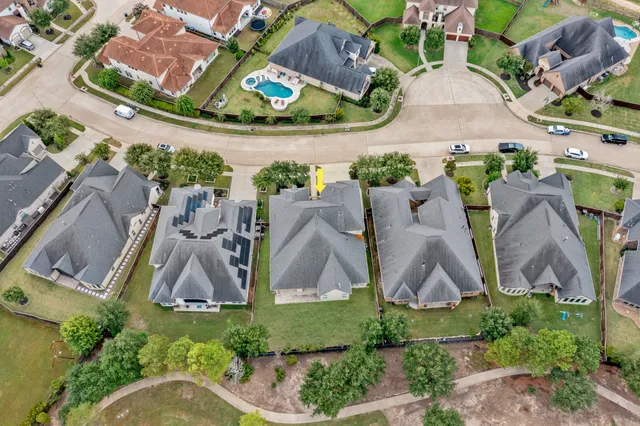 an aerial view of a highlighted house