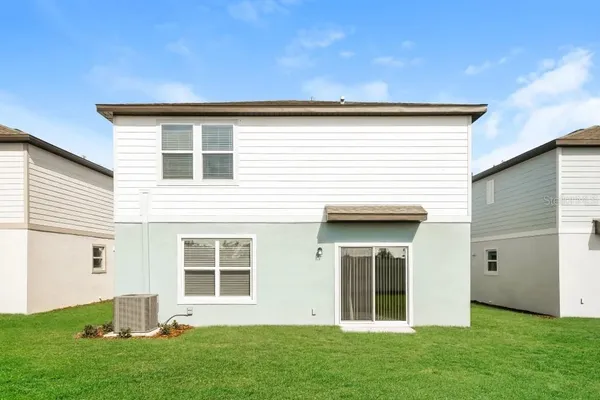 a view of backyard with windows