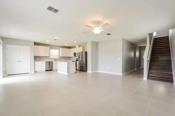 a view of a kitchen with furniture and a kitchen