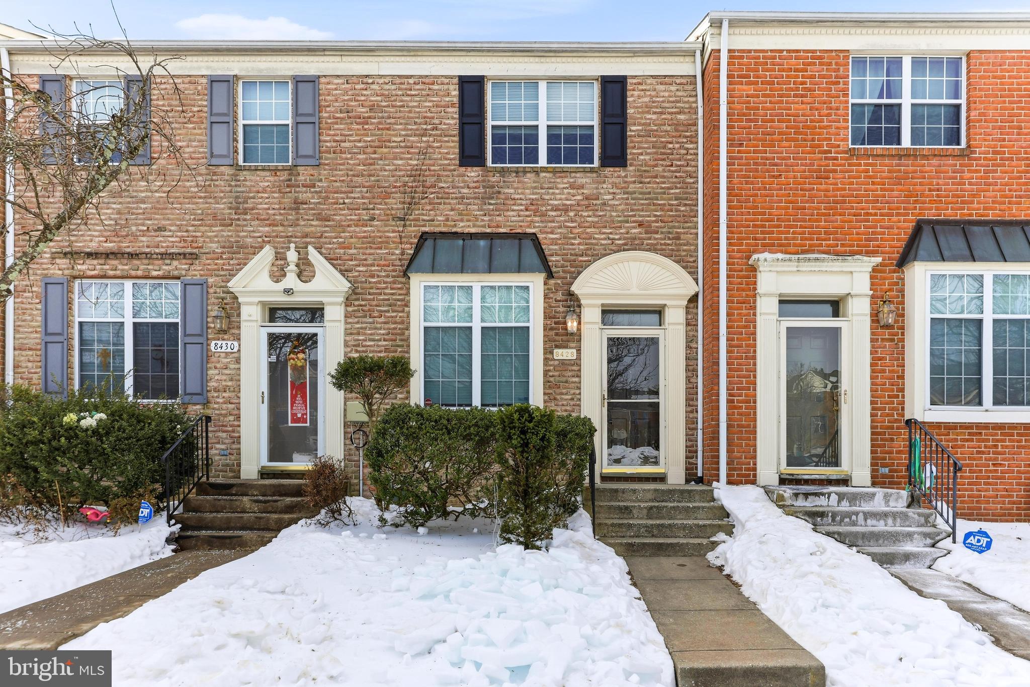 8428 Gold Sunset Way Columbia, MD 21045 - Photo 1 of 43 a front view of a house with a yard