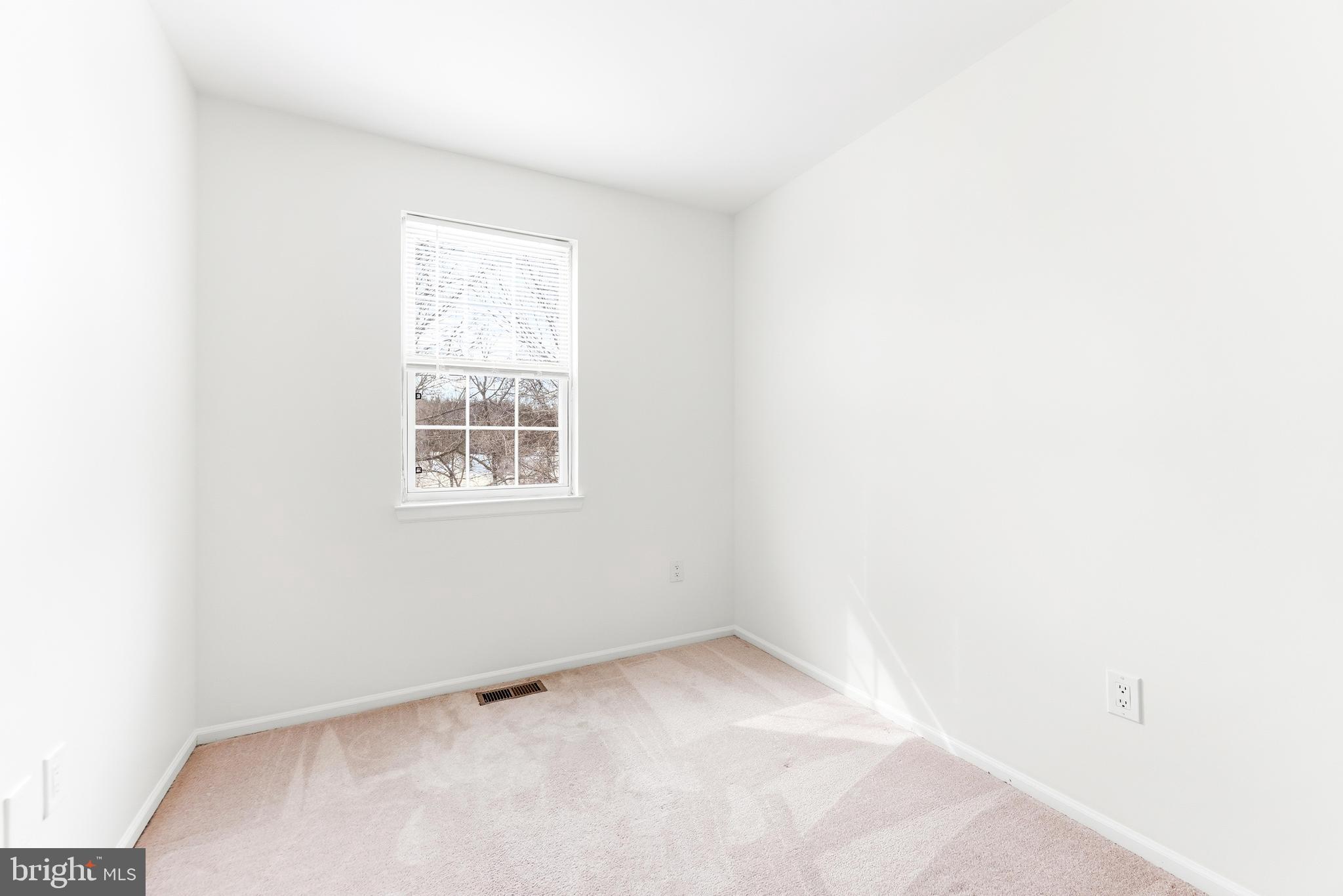8428 Gold Sunset Way Columbia, MD 21045 - Photo 21 of 43 an empty room with a window