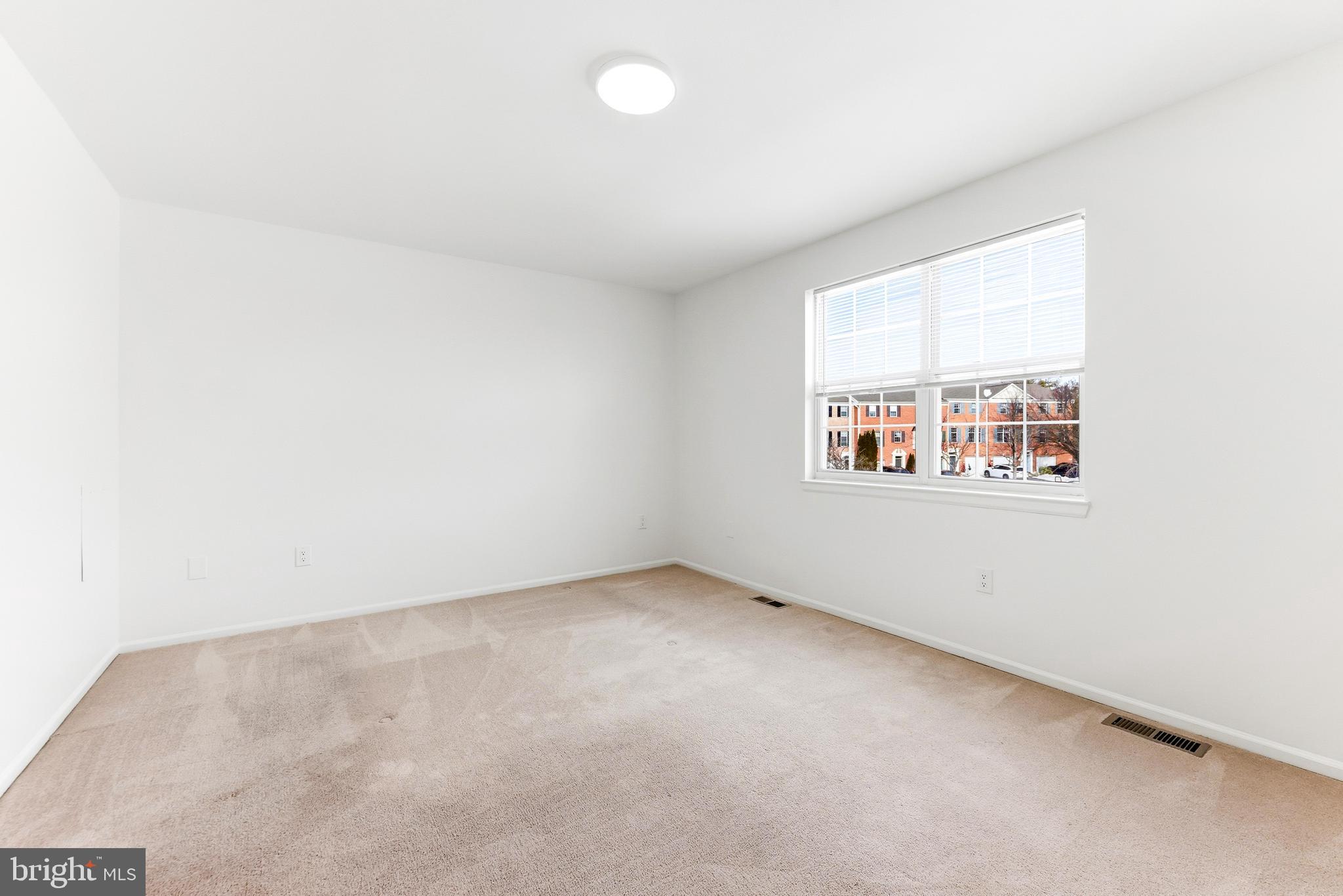 8428 Gold Sunset Way Columbia, MD 21045 - Photo 25 of 43 an empty room with windows