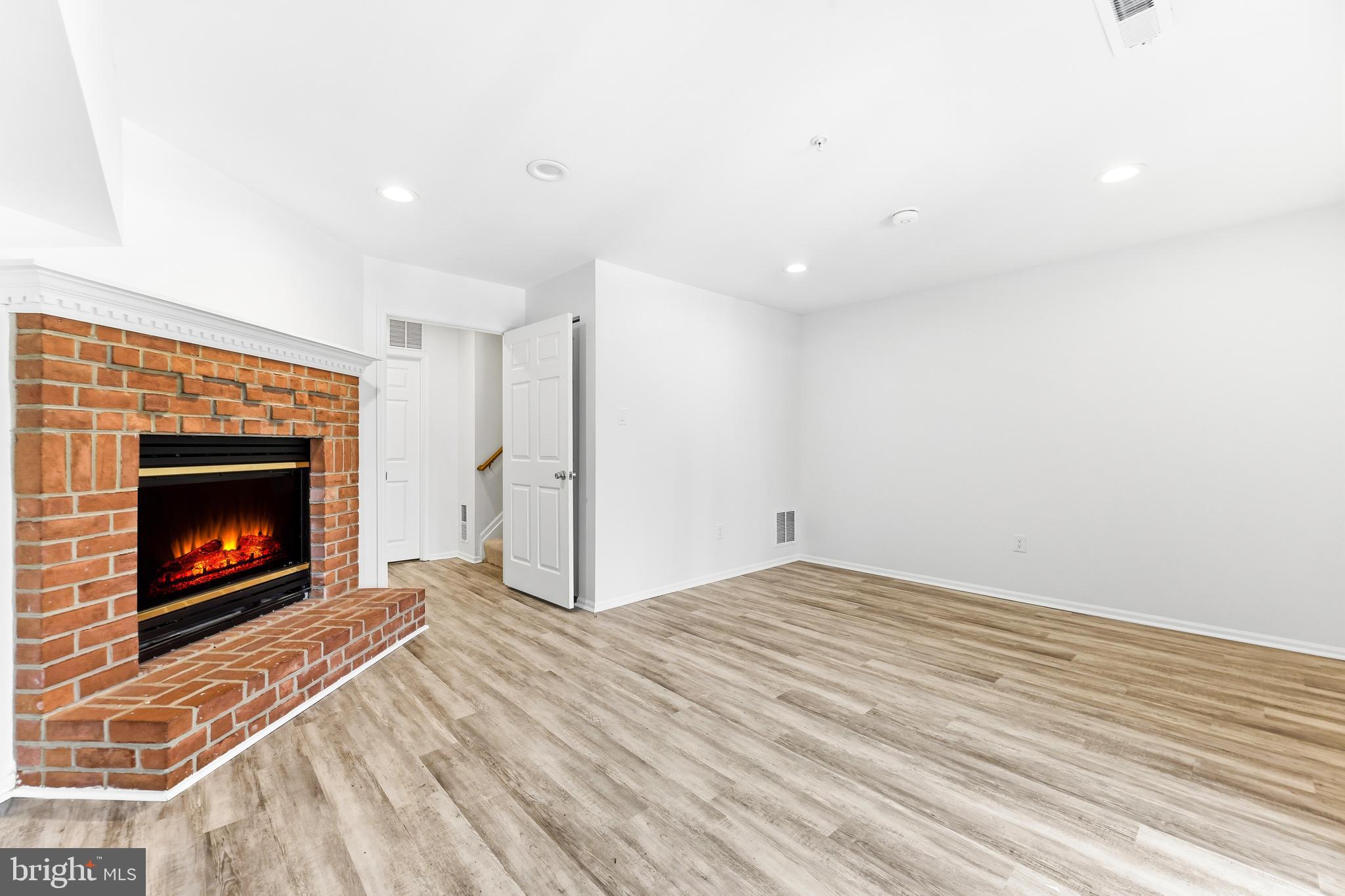 8428 Gold Sunset Way Columbia, MD 21045 - Photo 34 of 43 a view of empty room with a fireplace
