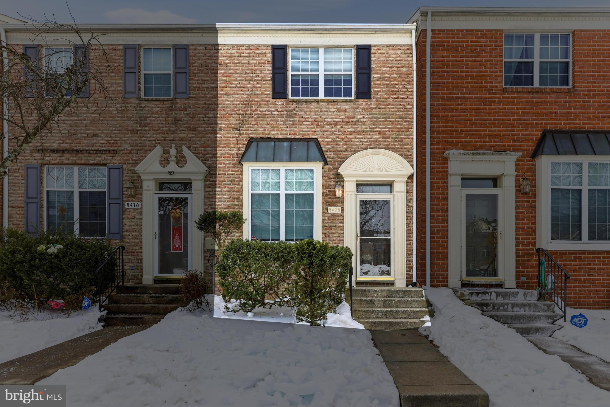 8428 Gold Sunset Way Columbia, MD 21045 - Photo 43 of 43 a front view of a house with a garden
