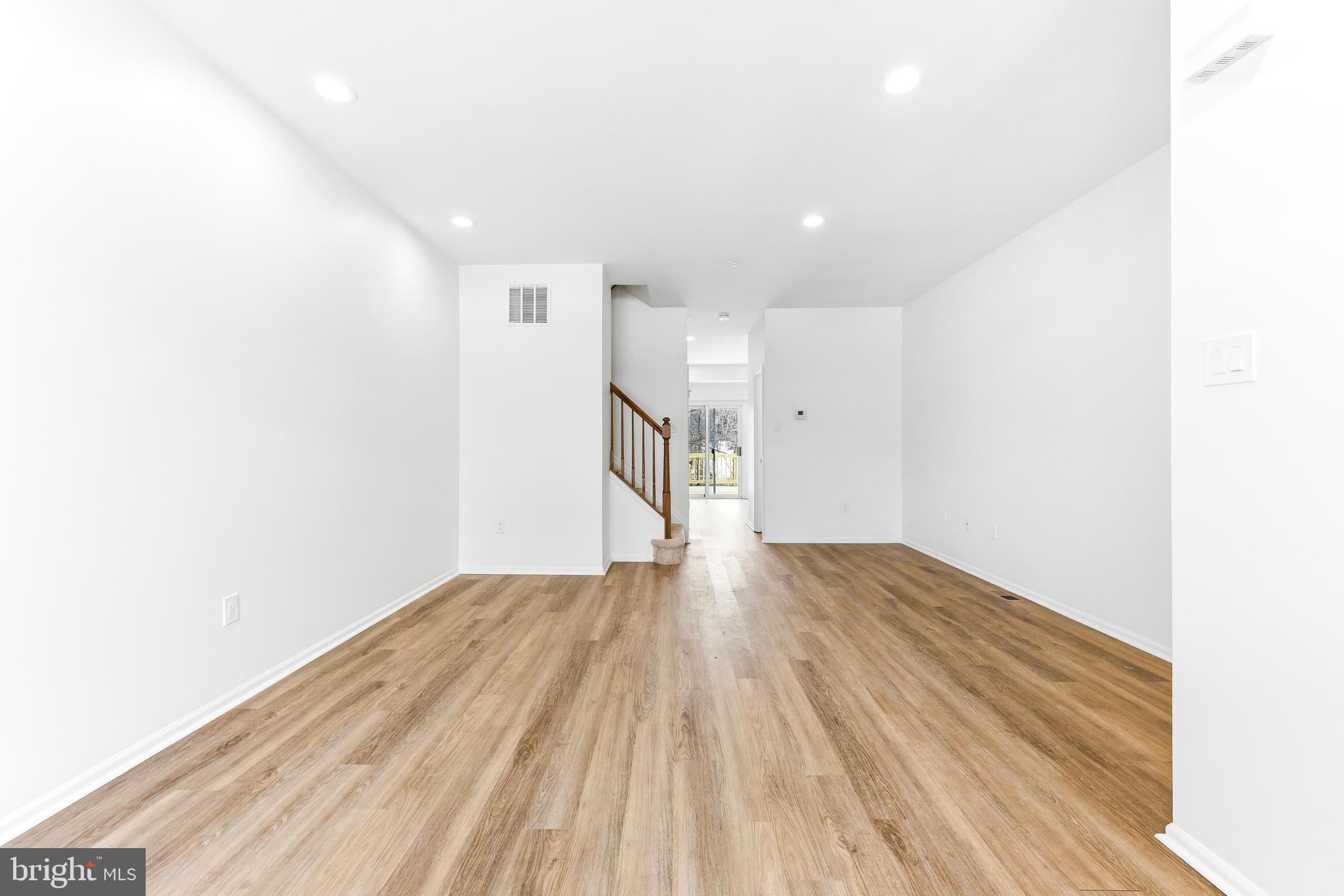 8428 Gold Sunset Way Columbia, MD 21045 - Photo 5 of 43 a view of empty room with wooden floor