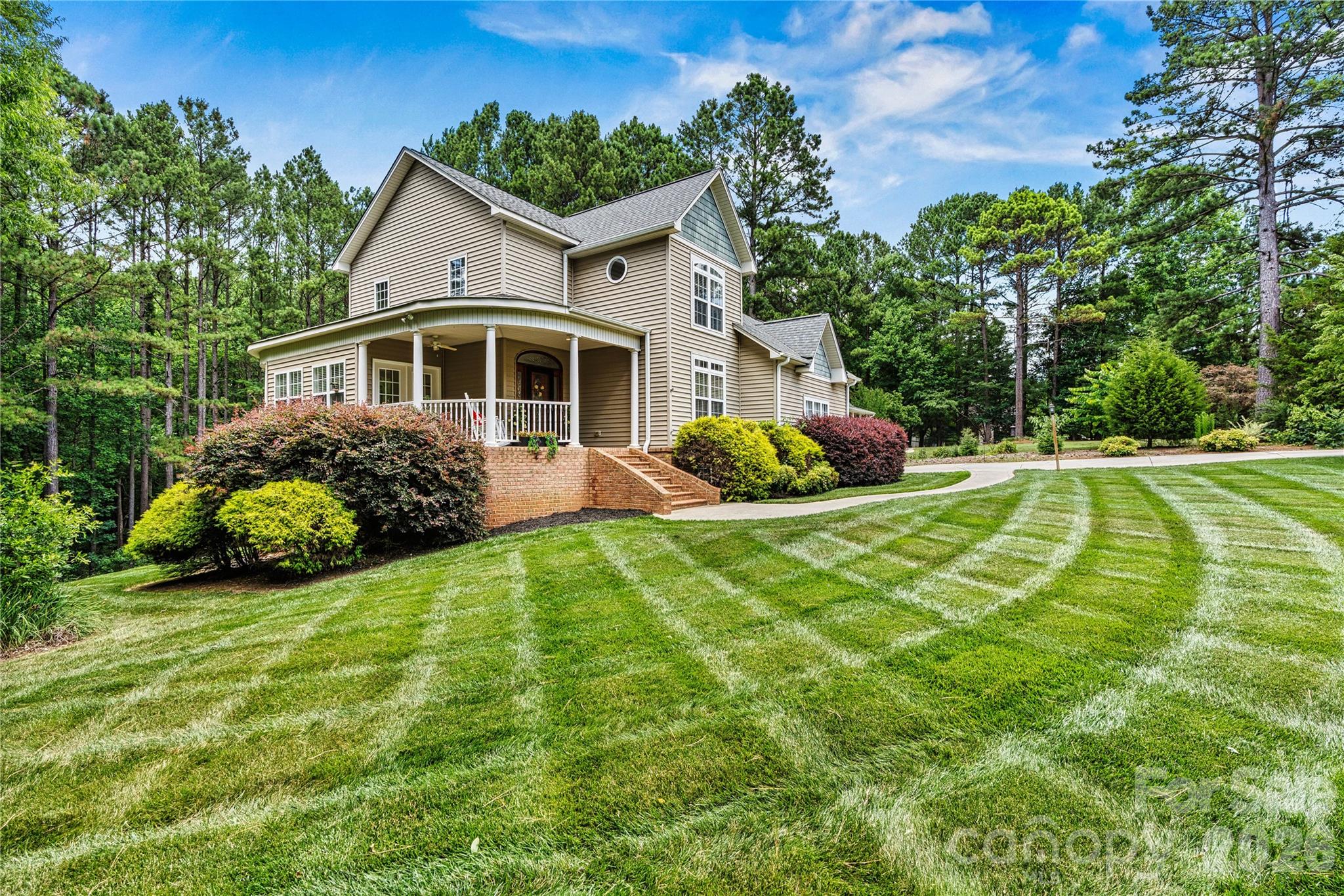 1606 High Ridge Drive Stanley, NC 28164 - Photo 44 of 44 a front view of a house with garden