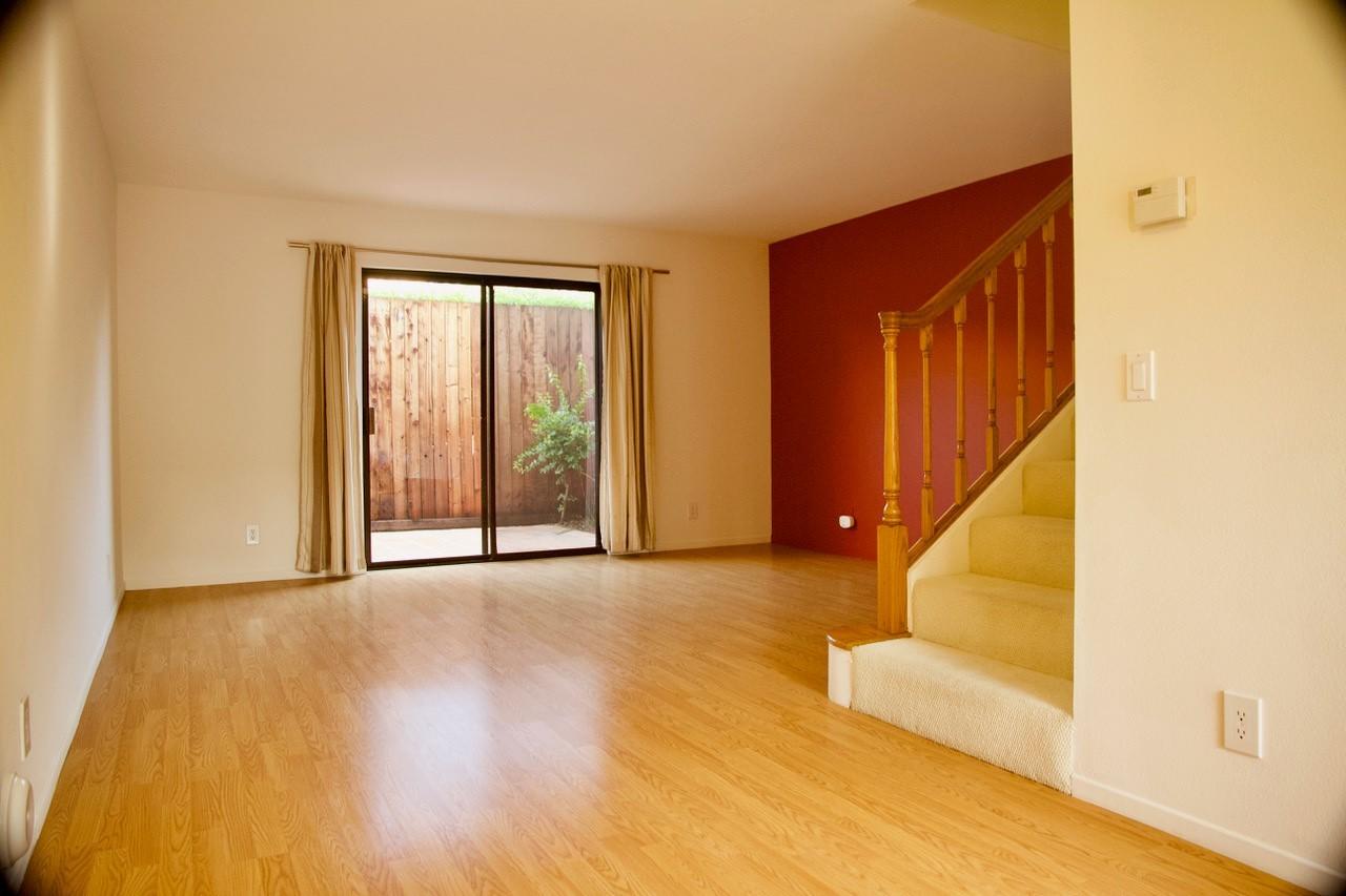 4344 Modoc Road, Unit 3 Santa Barbara, CA 93110 - Photo 3 of 8 a view of an empty room with wooden floor and a window