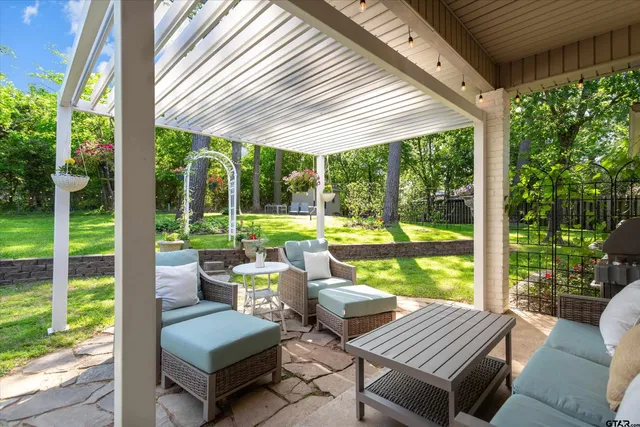 a view of a patio with chairs and floor