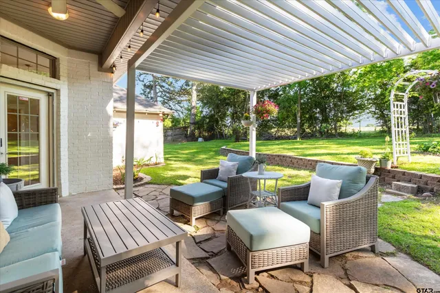 a view of swimming pool and outdoor seating