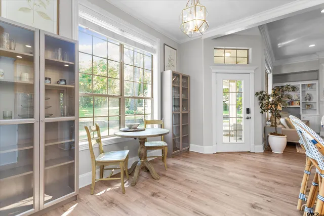a view of a livingroom with furniture window and wooden floor
