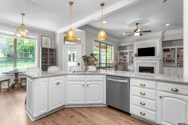 a kitchen with a sink stove and microwave