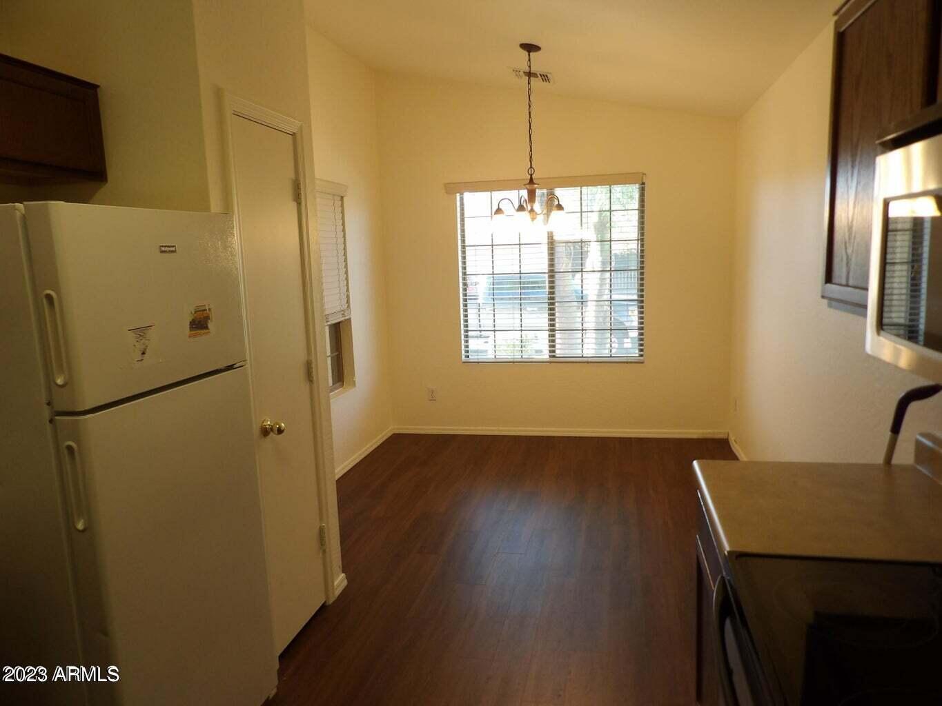 23742 West Hidalgo Avenue Buckeye, AZ 85326 - Photo 11 of 25 a view of an empty room with a window