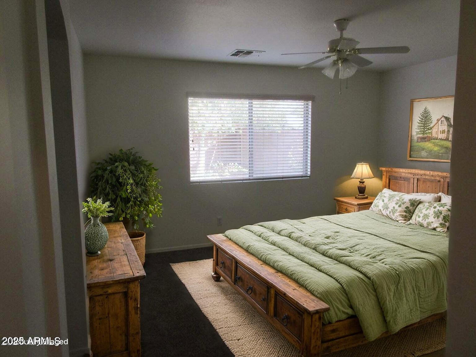 23742 West Hidalgo Avenue Buckeye, AZ 85326 - Photo 15 of 25 a bedroom with a bed and a window