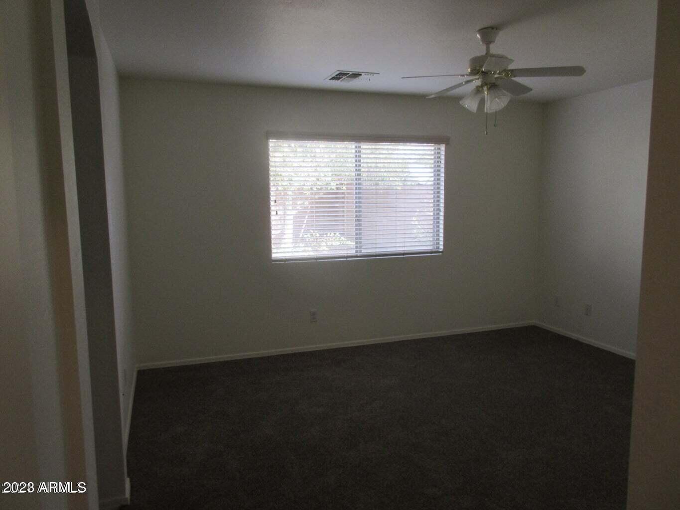 23742 West Hidalgo Avenue Buckeye, AZ 85326 - Photo 17 of 25 an empty room with a window